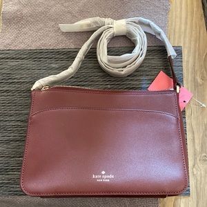 Kate spade new with tags medium zip crossbody. Burgundy color